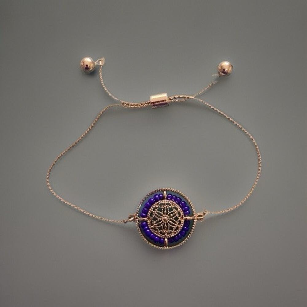 Gold tone beaded wheel adjustable bracelet
